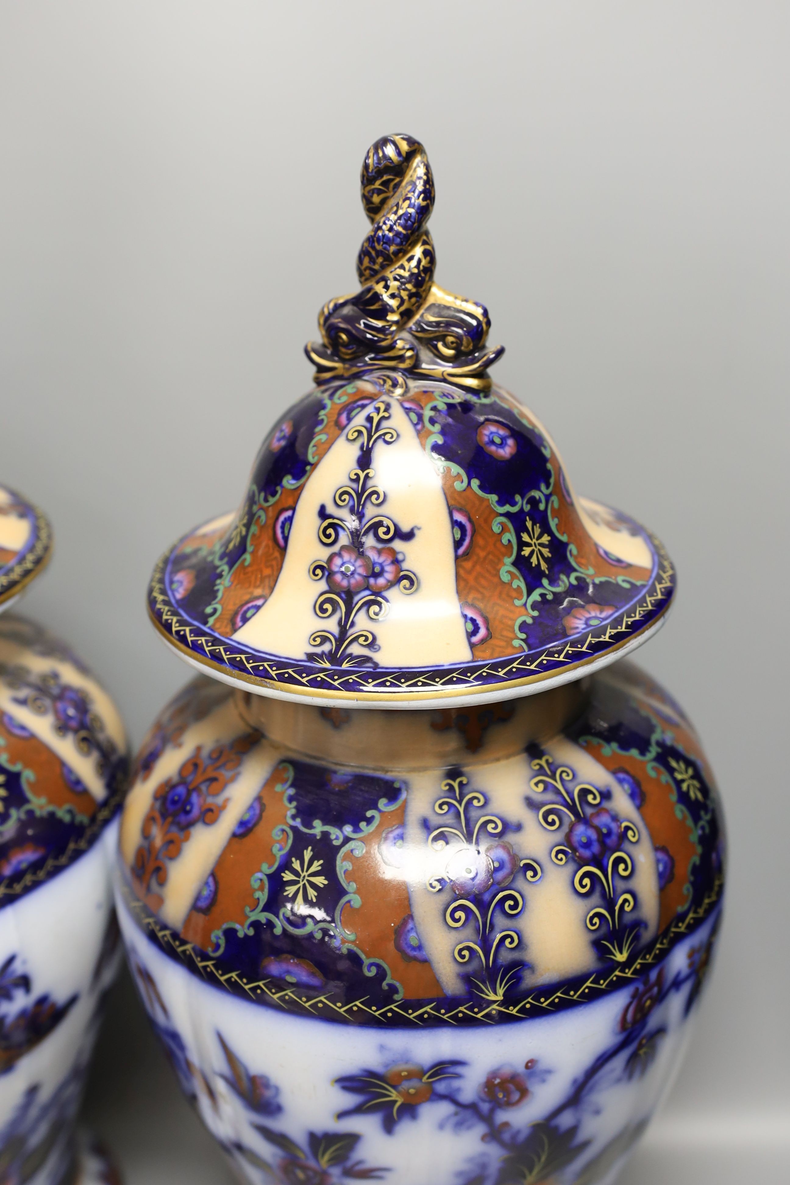 A pair of mid 19th century ironstone vases and covers - 51cm tall